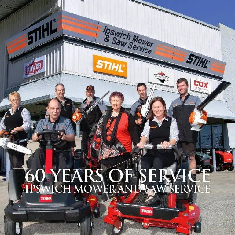 Ipswich Mower & Saw Service Newspaper cover for 60 years, photo of the team holding powertools and riding lawn equiptment in front of the old shop on warwick road.